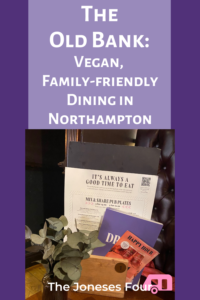 Pinterest image for article reviewing The Old Bank restaurant in Northampton, England. Image of menus on a purple background. Title "The Old Bank: Vegan, Family-Friendly Dining in Northampton" is written in white text at the top; blog title "The Joneses Four" is written along the bottom.
